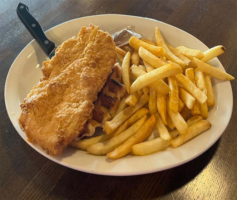 Fried chicken with french fries at Blū Restaurant